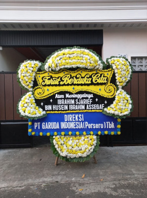 Papan Bunga Duka di Topiyai