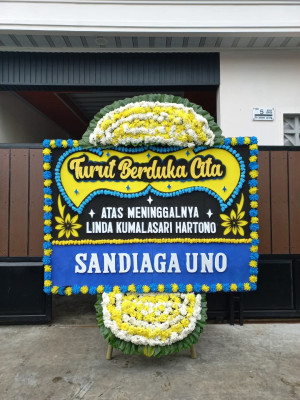 Papan Bunga Duka di Topiyai