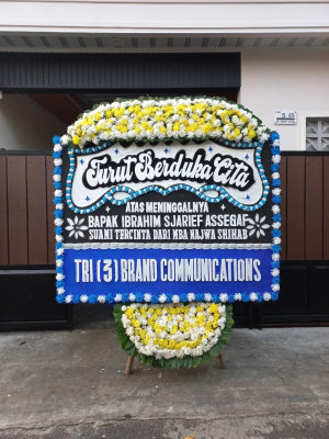 Papan Bunga Duka di Topiyai
